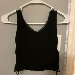 Black tank top with lace on the top and ties on both sides